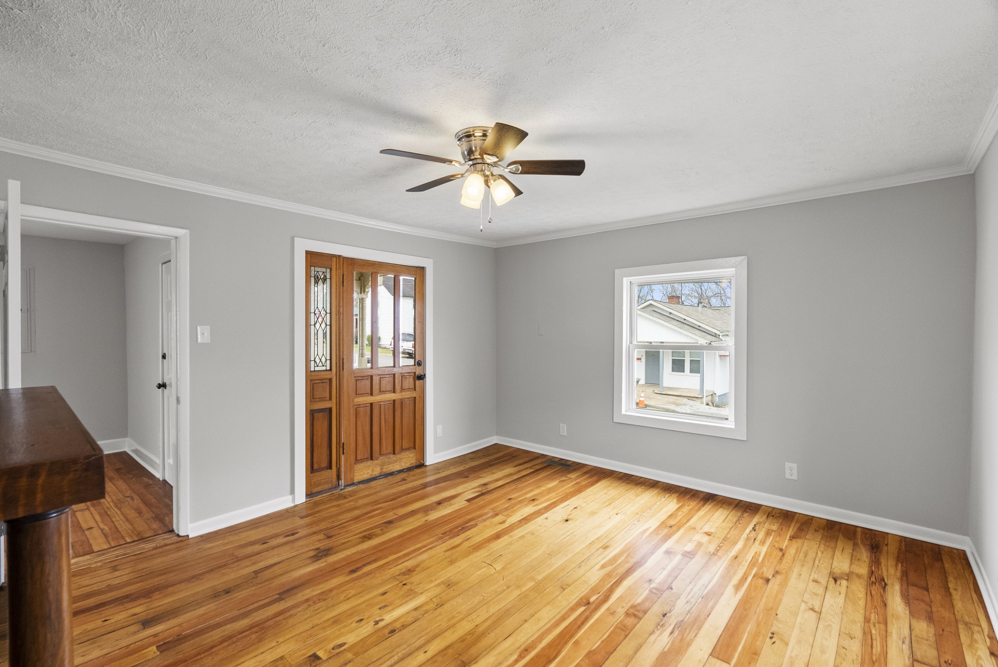 104 North Walnut Street Springfield, TN 37172 - Photo 5 of 19 a view of empty room with wooden floor and fan