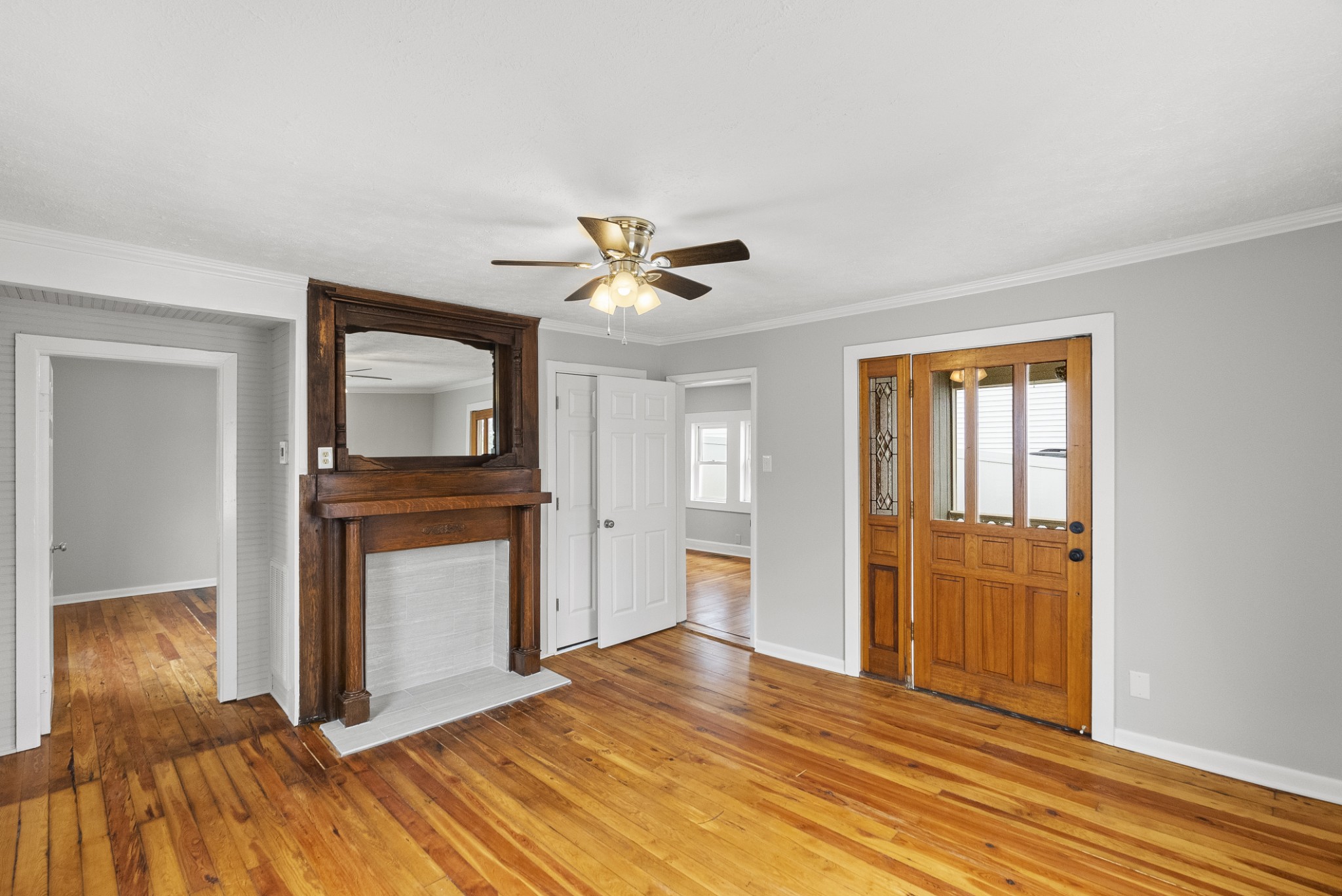 104 North Walnut Street Springfield, TN 37172 - Photo 7 of 19 a view of a livingroom with wooden floor and a ceiling fan