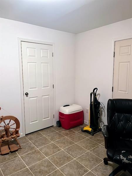 281 Castile Ridge Road Marianna, PA 15345 - Photo 28 of 39 a room with gym equipment and a mirror