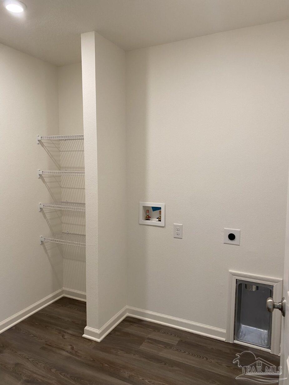 9252 3 Hollow Road Jay, FL 32565 - Photo 11 of 18 a view of a small space with wooden floor and a window