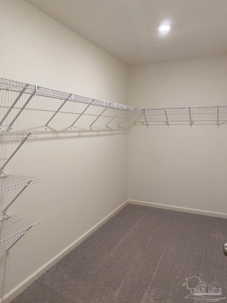 9252 3 Hollow Road Jay, FL 32565 - Photo 12 of 18 a view of a room with racks on the wall