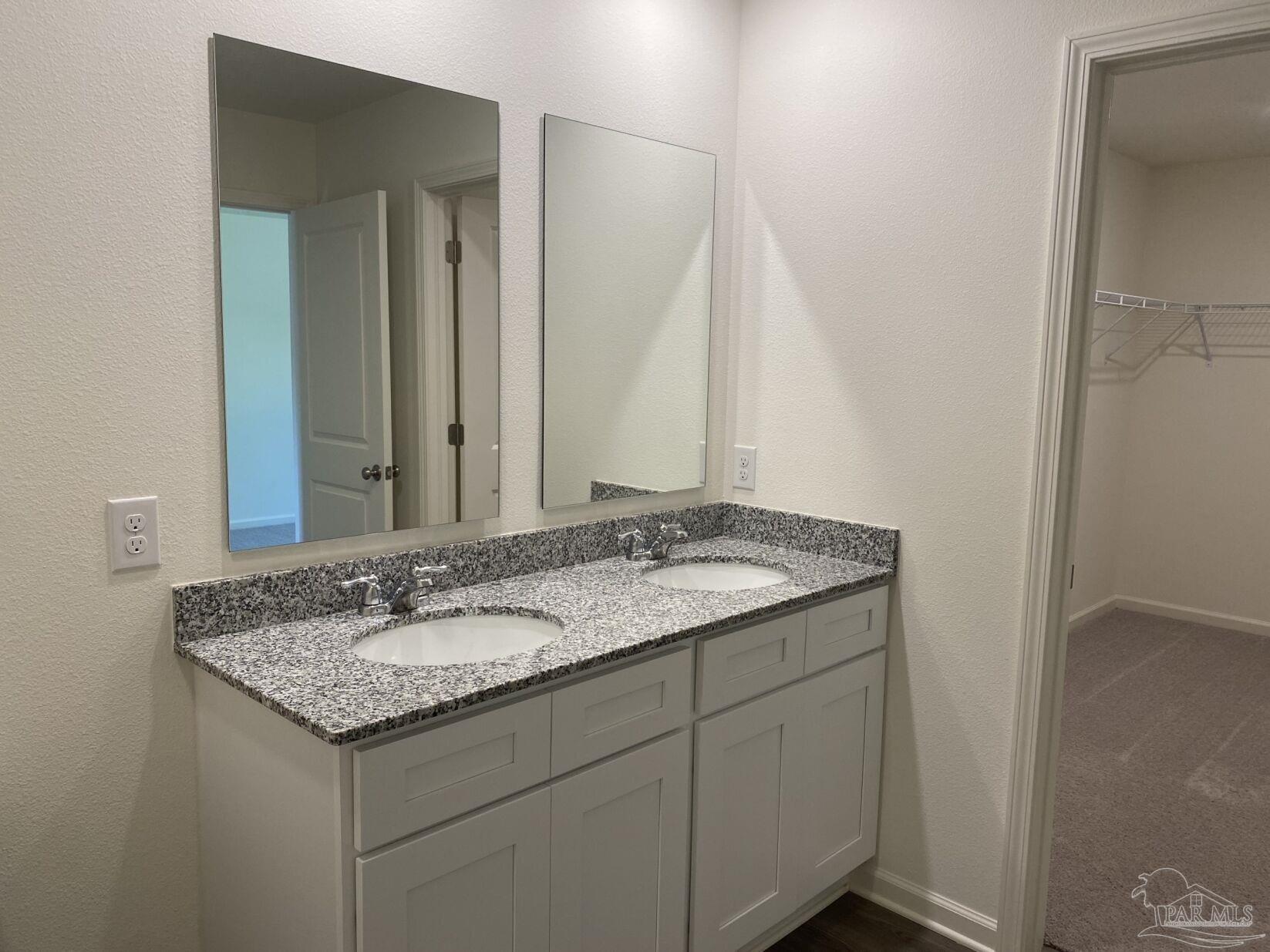 9252 3 Hollow Road Jay, FL 32565 - Photo 13 of 18 a bathroom with a granite countertop sink and a mirror