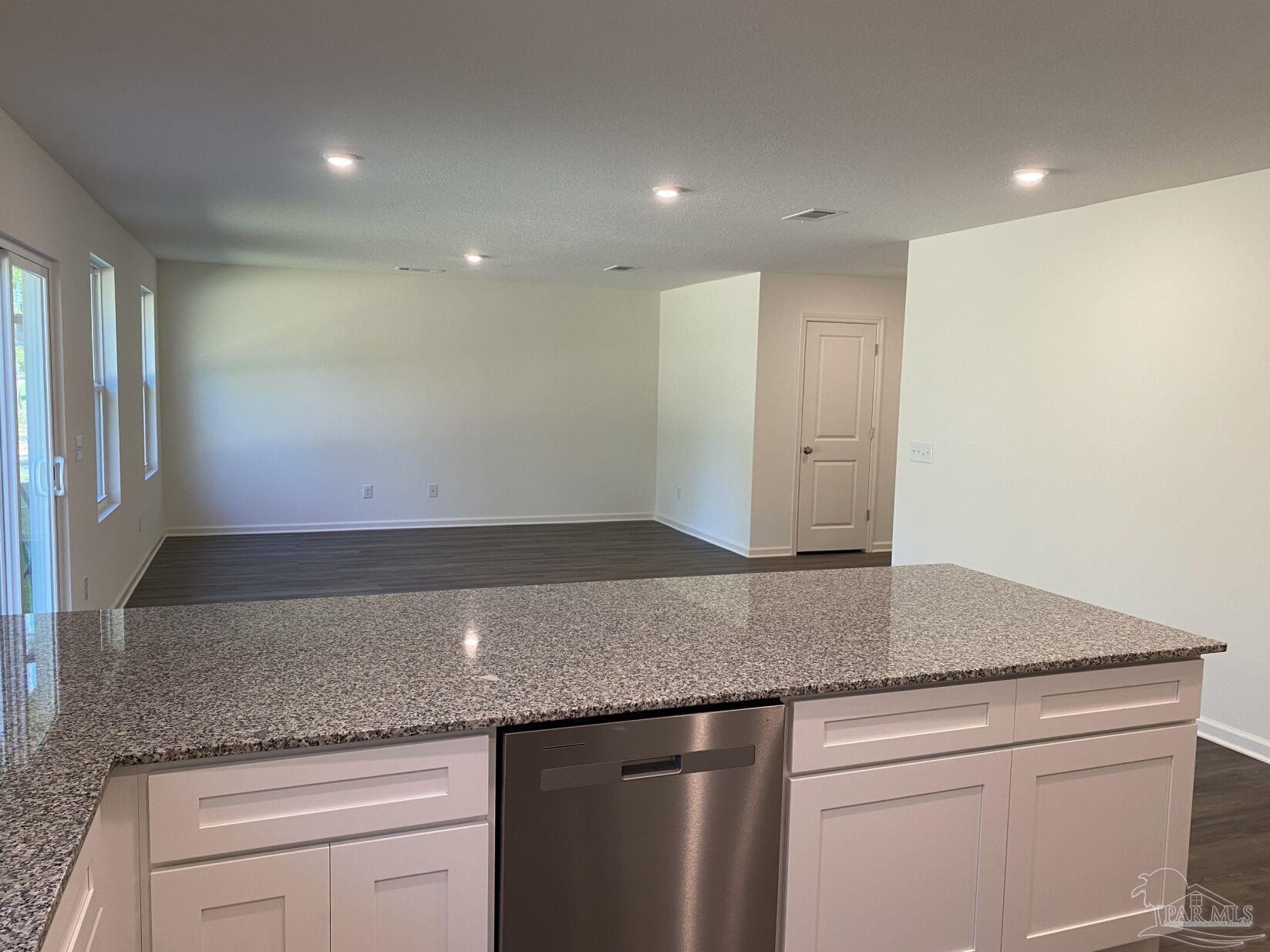 9252 3 Hollow Road Jay, FL 32565 - Photo 7 of 18 a kitchen with granite countertop cabinets stainless steel appliances and a counter tops