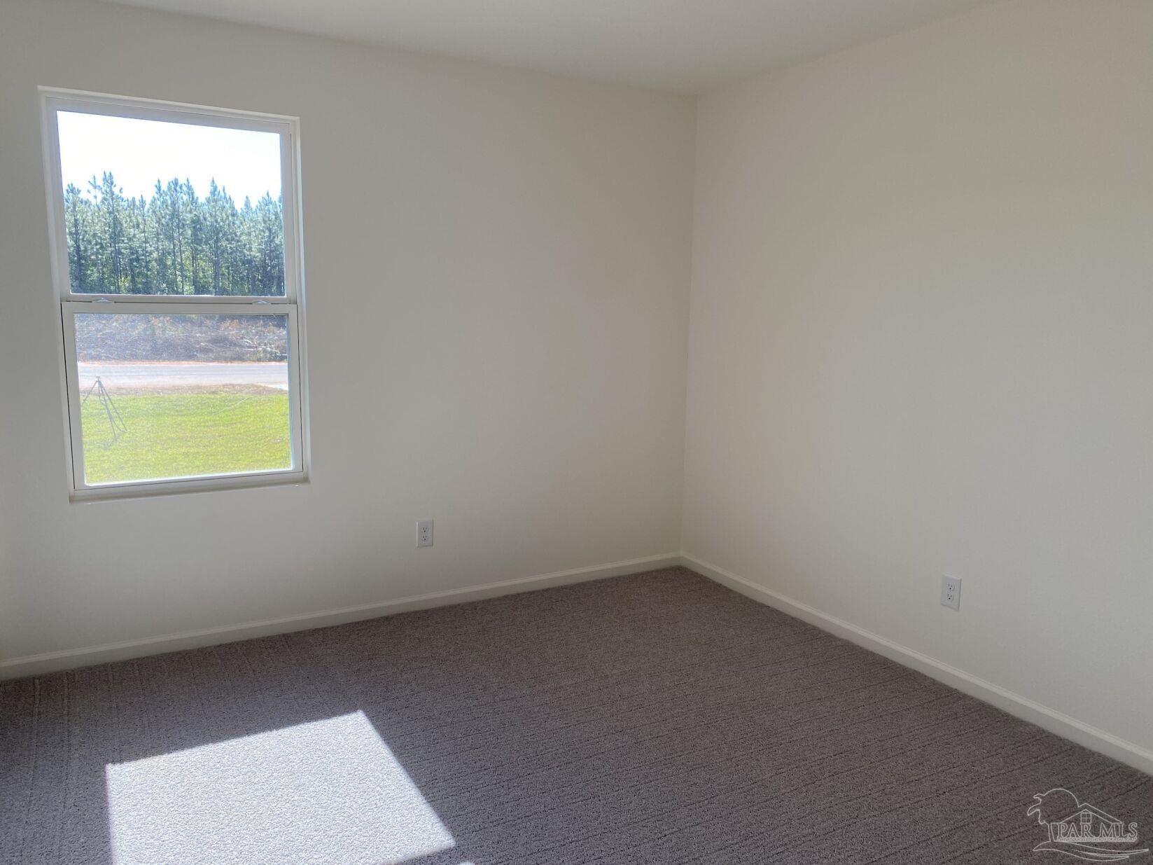 9252 3 Hollow Road Jay, FL 32565 - Photo 8 of 18 an empty room with a window