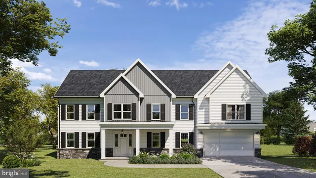 a front view of a house with a garden and plants