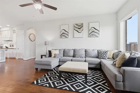 a living room with furniture and a rug