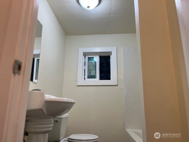 12524 Addison Street Southwest Lakewood, WA 98499 - Photo 5 of 17 a bathroom with a toilet and a sink