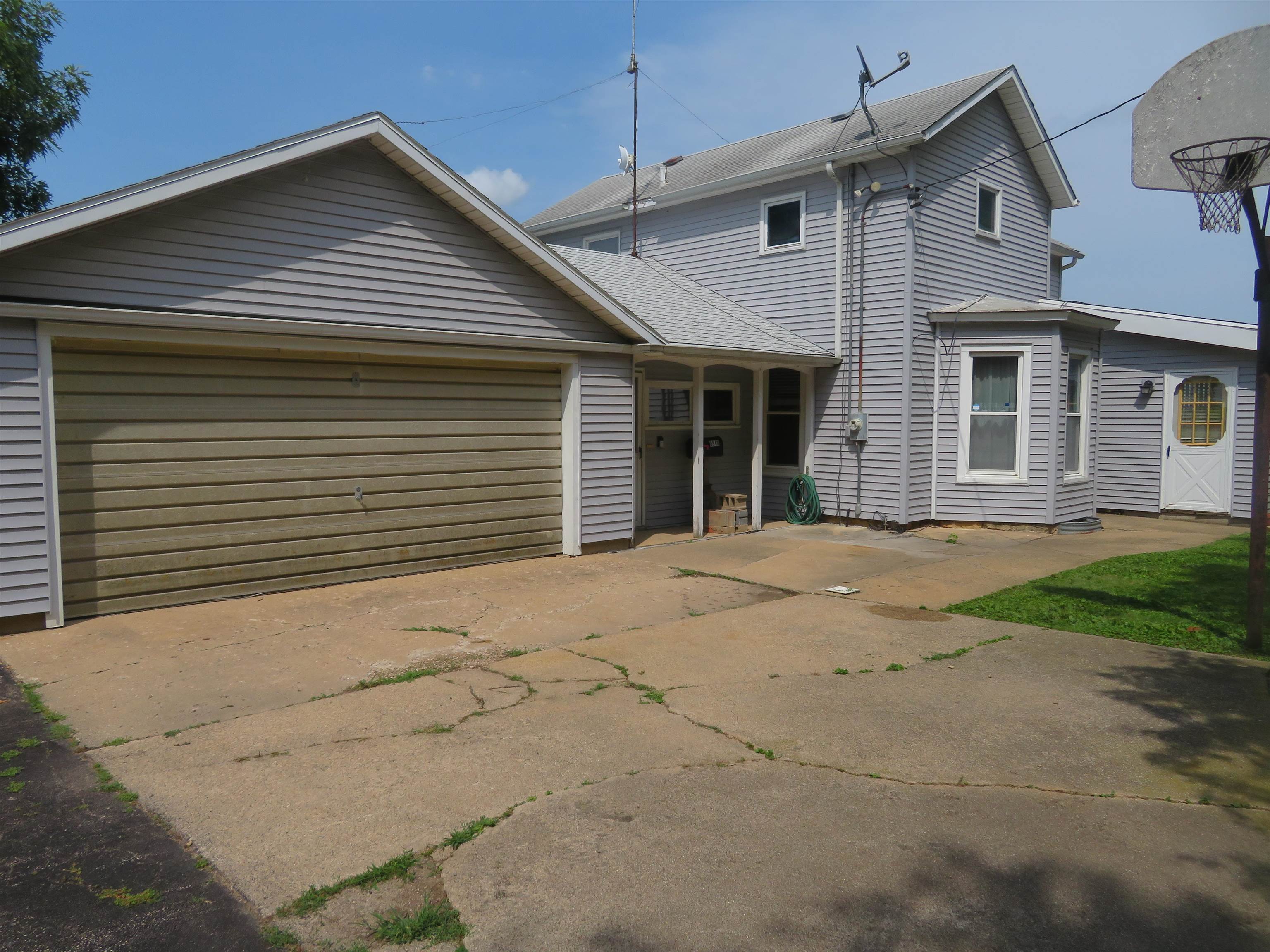 6940 West Stephenson St Road Freeport, IL 61032 - Photo 1 of 25 a view of a house with a yard