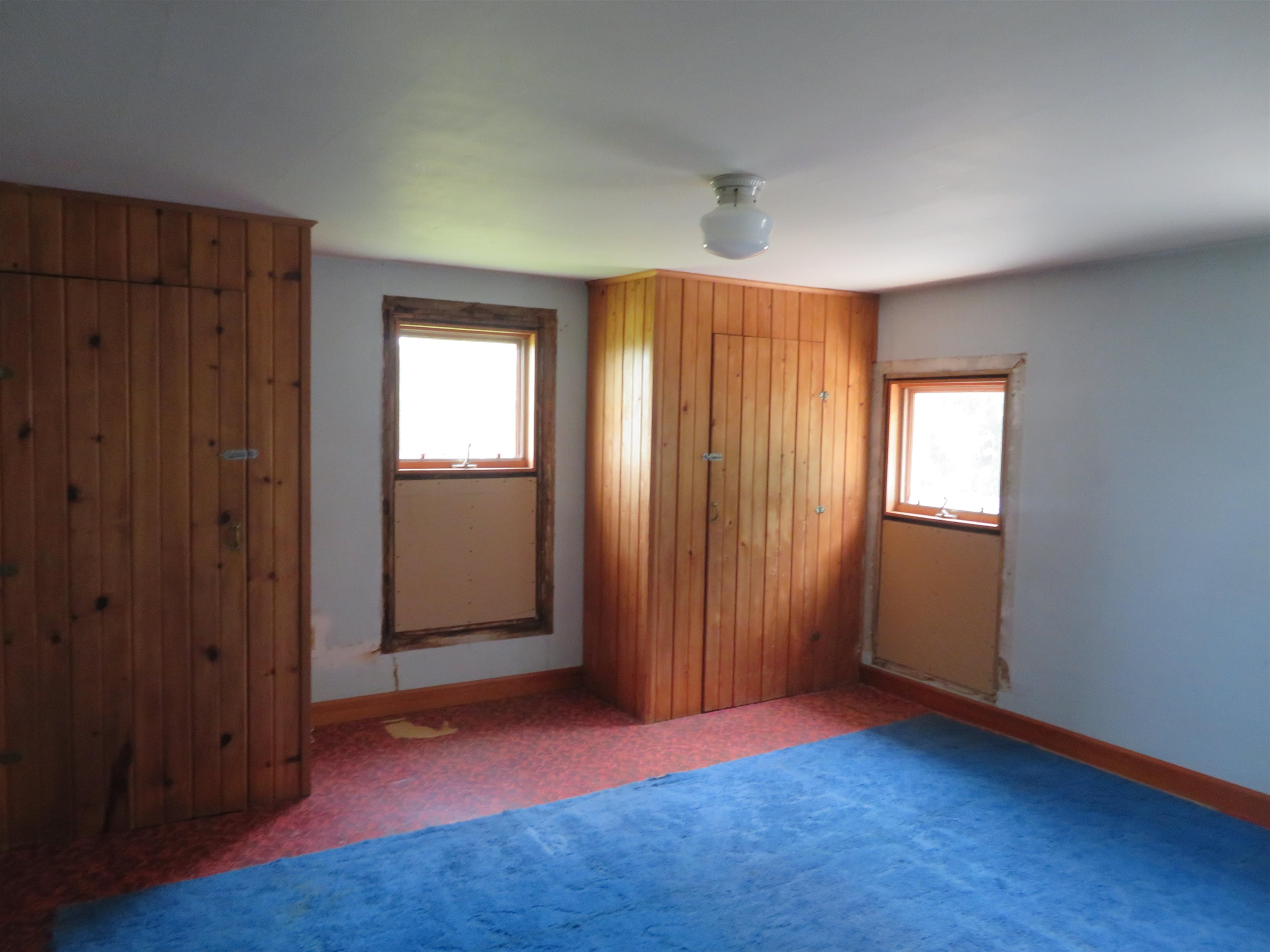 6940 West Stephenson St Road Freeport, IL 61032 - Photo 13 of 25 an empty room with windows and closet