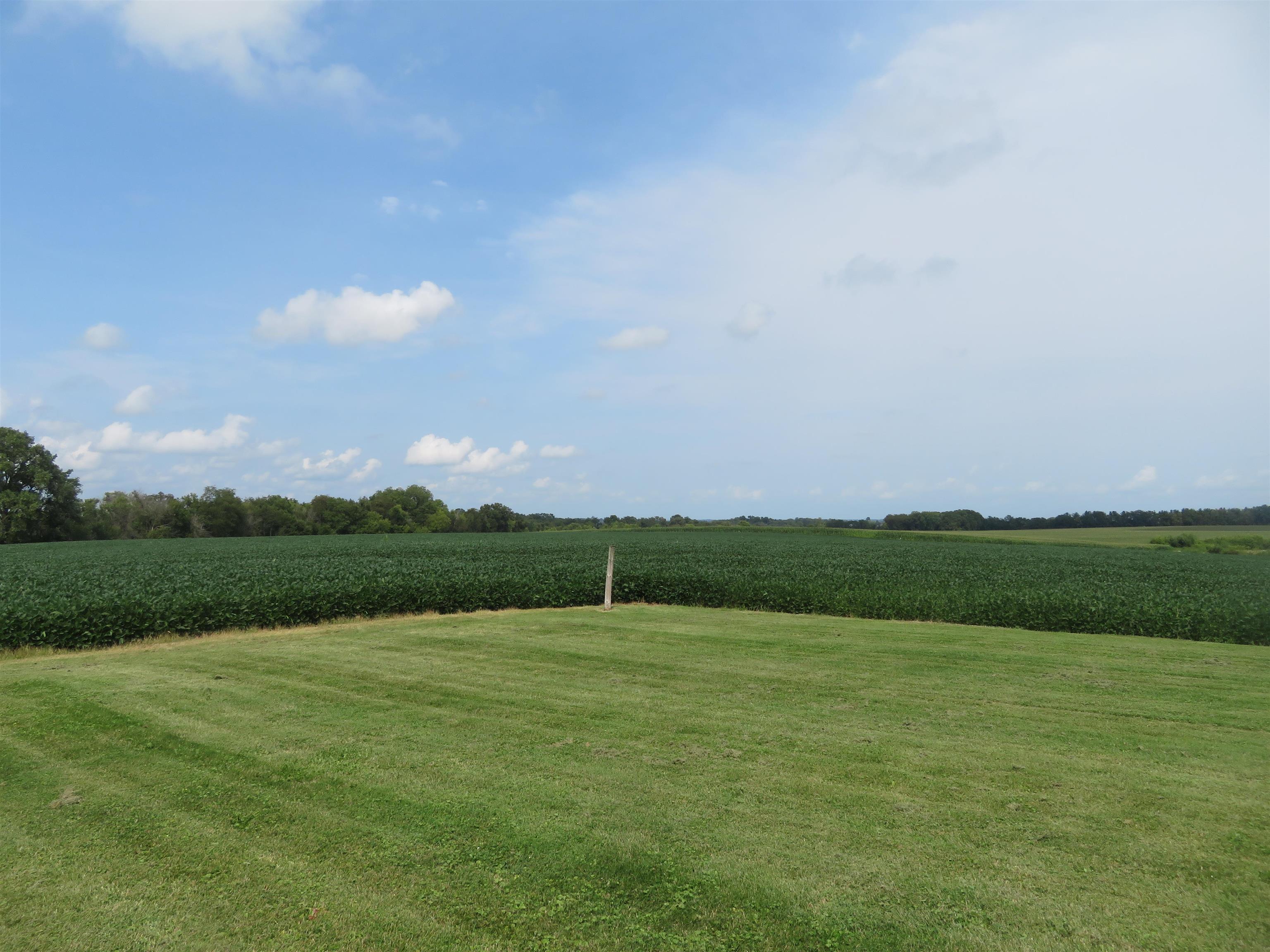 6940 West Stephenson St Road Freeport, IL 61032 - Photo 24 of 25 a view of a golf course with a lake