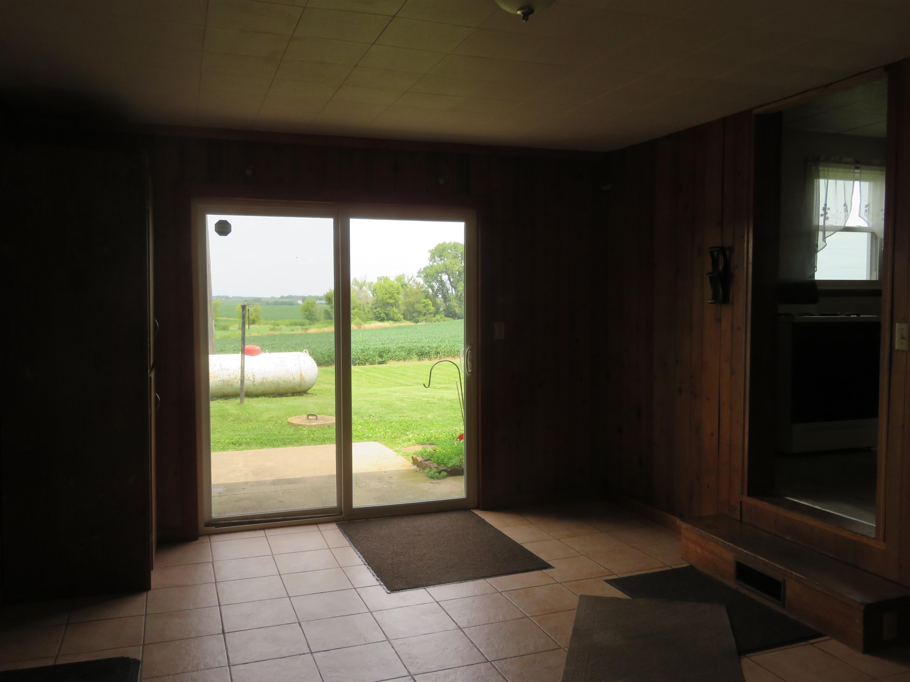 6940 West Stephenson St Road Freeport, IL 61032 - Photo 3 of 25 a view of an empty room and window