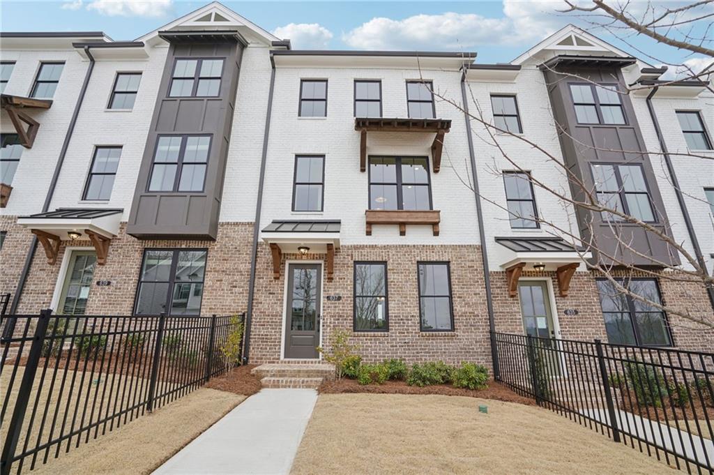 653 Silva Street, Unit 139 Cumming, GA 30040 - Photo 1 of 47 front view of a building