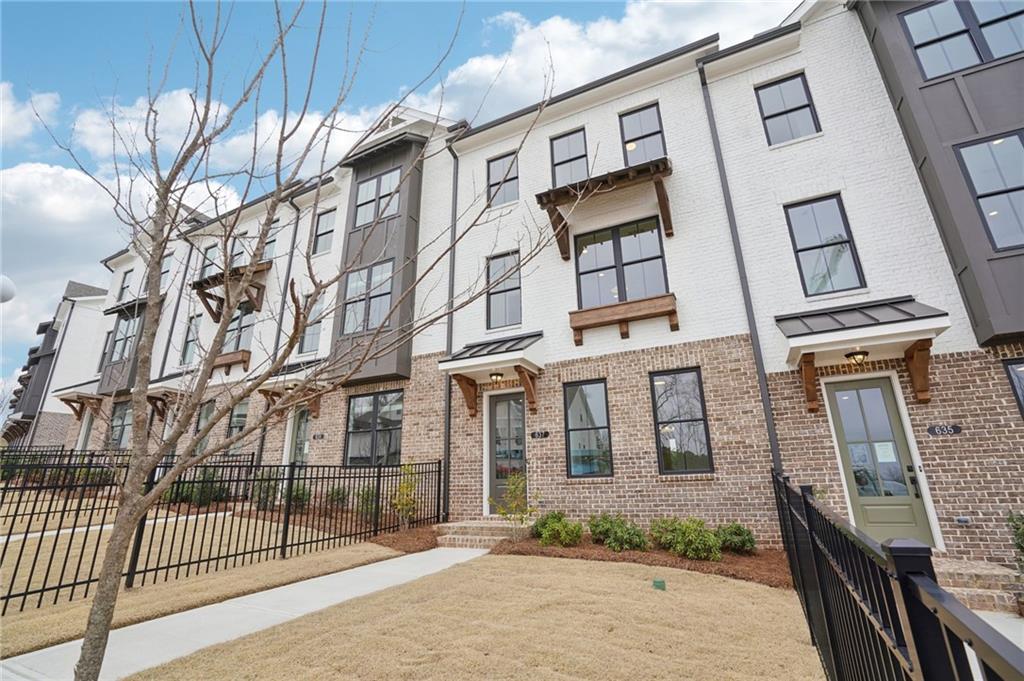 653 Silva Street, Unit 139 Cumming, GA 30040 - Photo 3 of 47 front view of a building