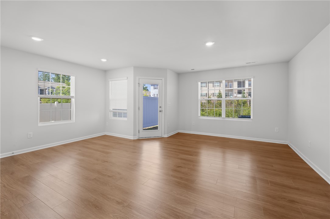 520 Brasstown Court Pendleton, SC 29670 - Photo 7 of 29 This bright, airy room features rich wood flooring and ample natural light, creating an inviting atmosphere.