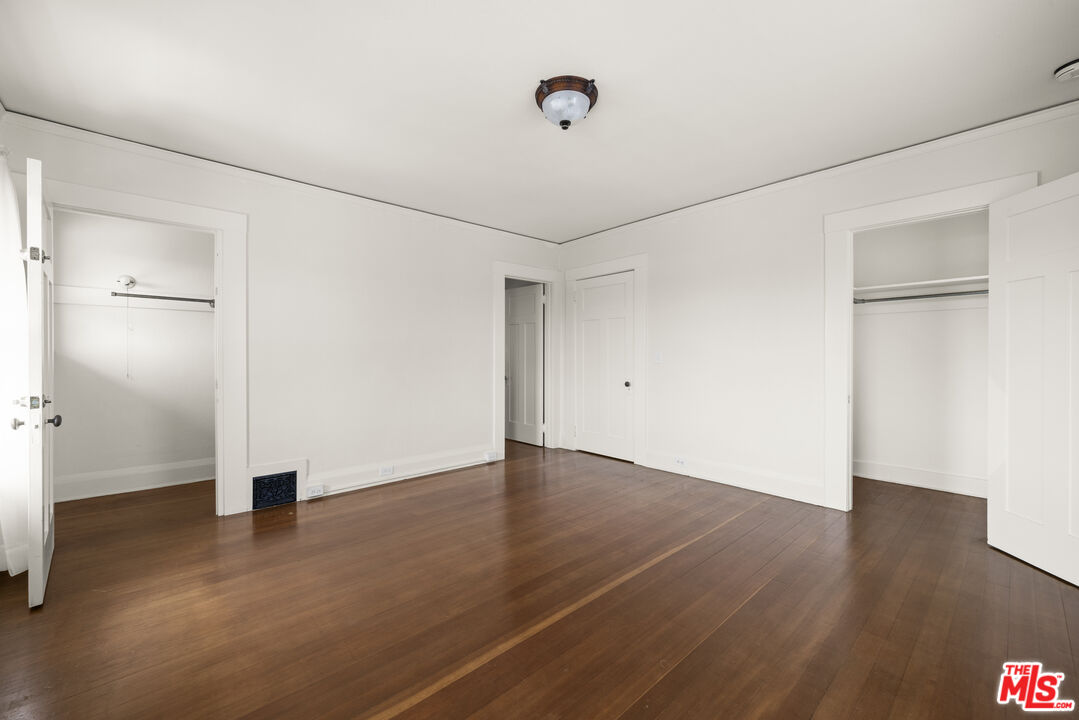2027 3rd Street Santa Monica, CA 90405 - Photo 11 of 17 an empty room with wooden floor and windows