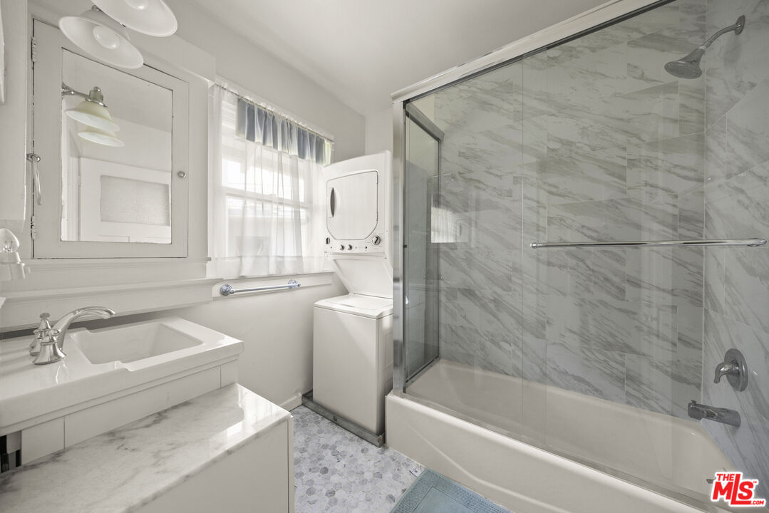 2027 3rd Street Santa Monica, CA 90405 - Photo 15 of 17 a bathroom with a sink a bathtub and a shower