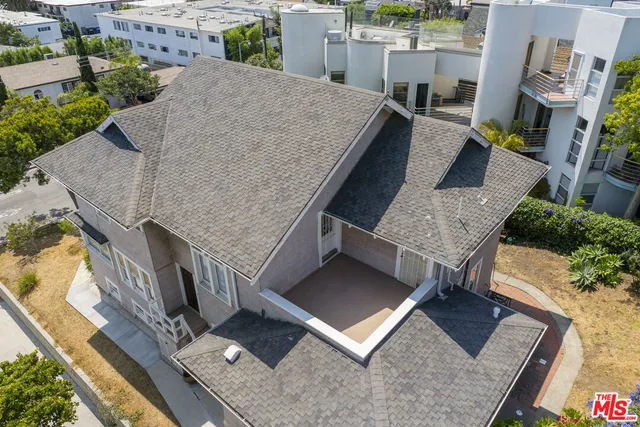 an aerial view of a house having yard