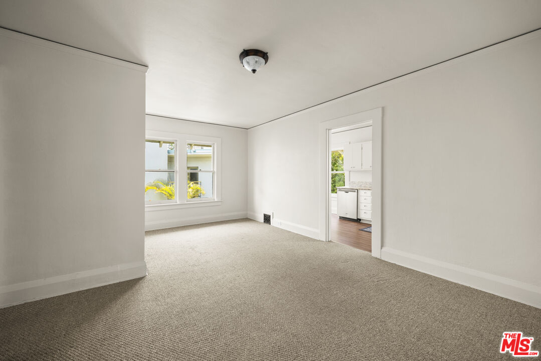 2027 3rd Street Santa Monica, CA 90405 - Photo 5 of 17 an empty room with windows and mirror