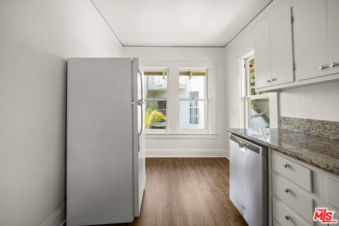 2027 3rd Street Santa Monica, CA 90405 - Photo 8 of 17 wooden floor in an empty room with a window