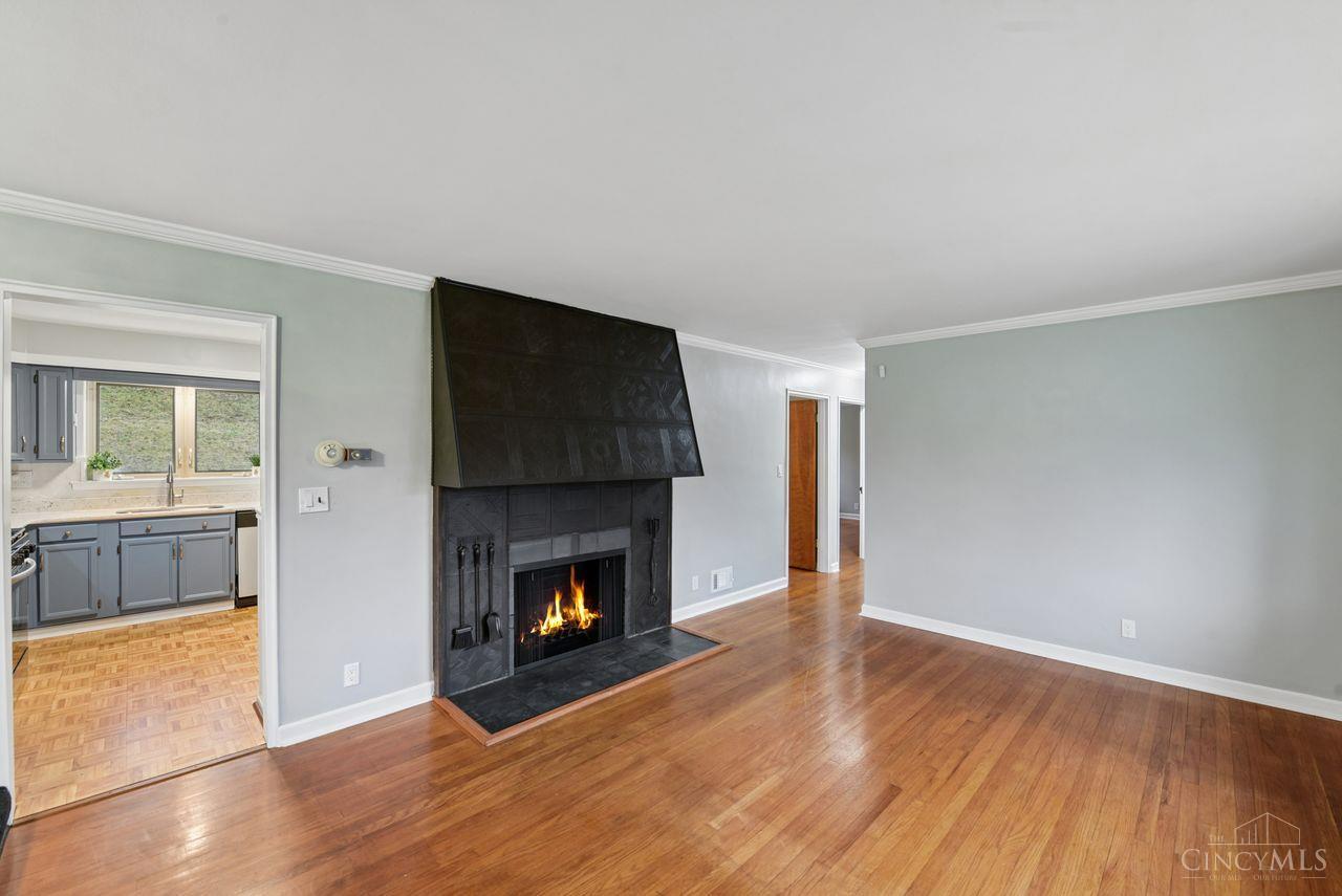 5258 Shepherd Road Cincinnati, OH 45223 - Photo 6 of 43 The Living Room features refinished wood flooring, a bay window and a fireplace that is inoperable.