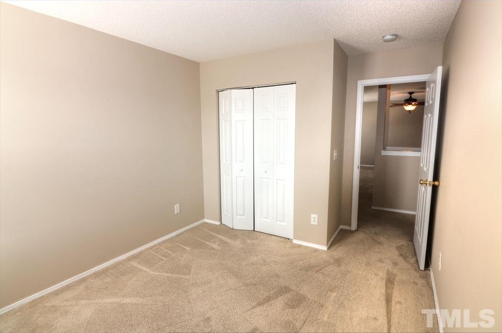 1013 Naylor Road Knightdale, NC 27545 - Photo 14 of 21 an empty room with closet and a bathroom