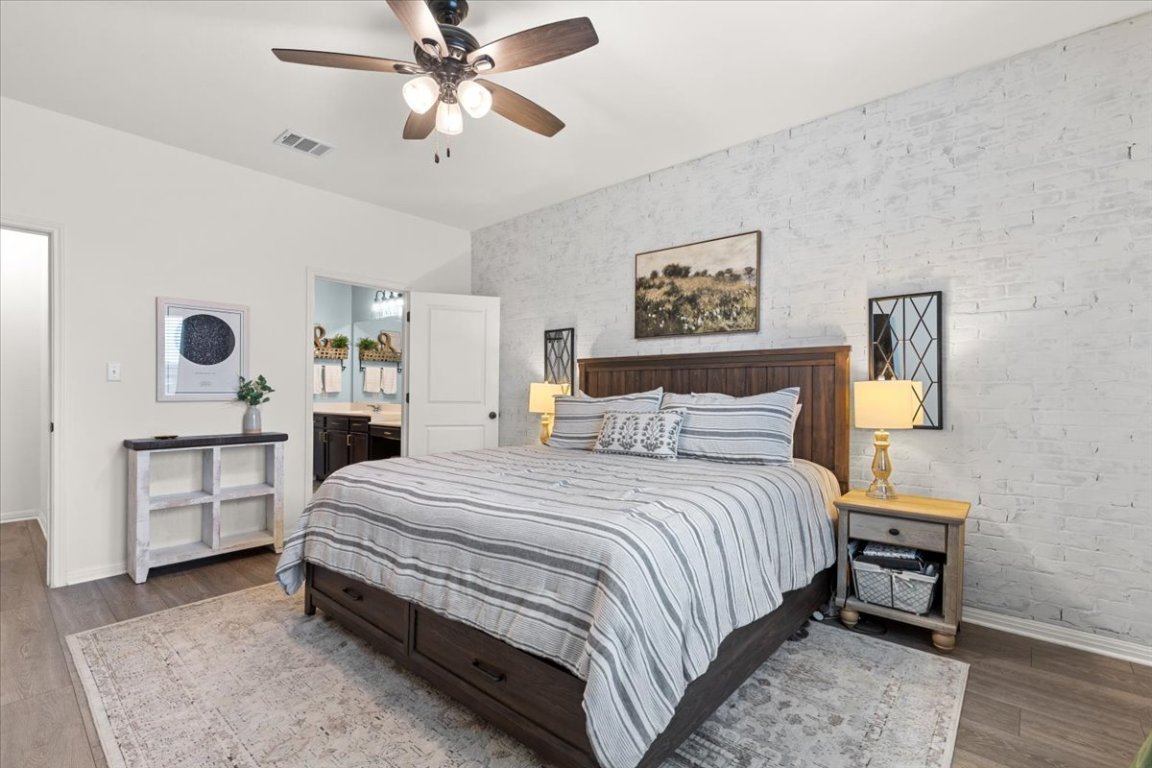 19305 Nathan Scott Way Manor, TX 78653 - Photo 10 of 18 a bedroom with a bed and a cabinets