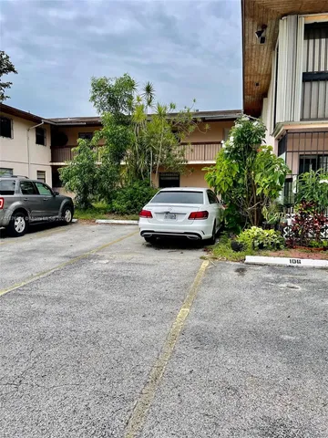 a view of street with parked cars