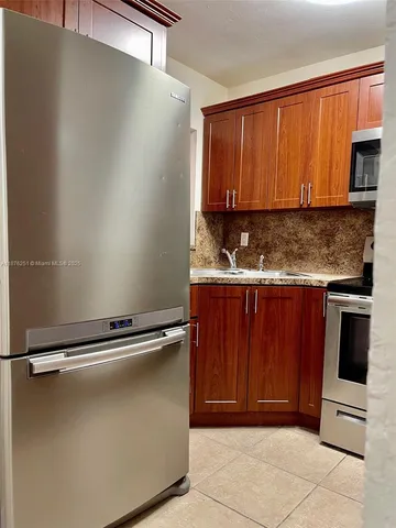 a view of a kitchen with a sink