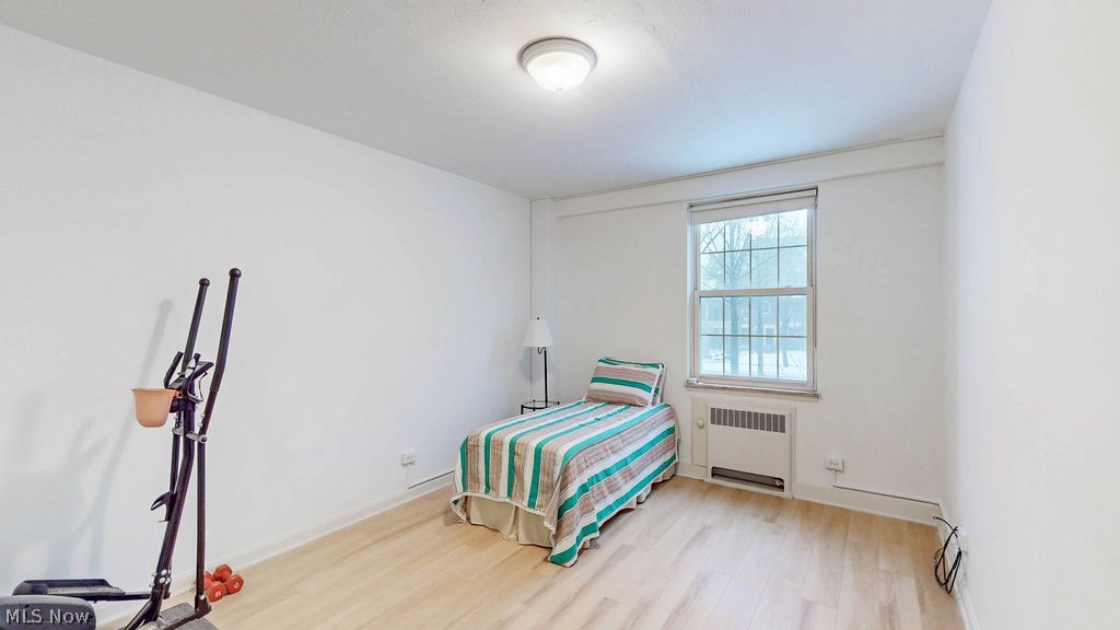 13800 Fairhill Road, Unit 203 Cleveland, OH 44120 - Photo 19 of 28 Secondary bedroom featuring white oak style LVP flooring.