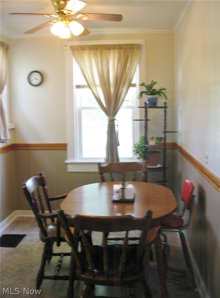 6395 Waterloo Road Atwater, OH 44201 - Photo 11 of 34 Dining Room with ceiling fan, vinyl flooring and two windows