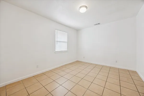an empty room with white walls