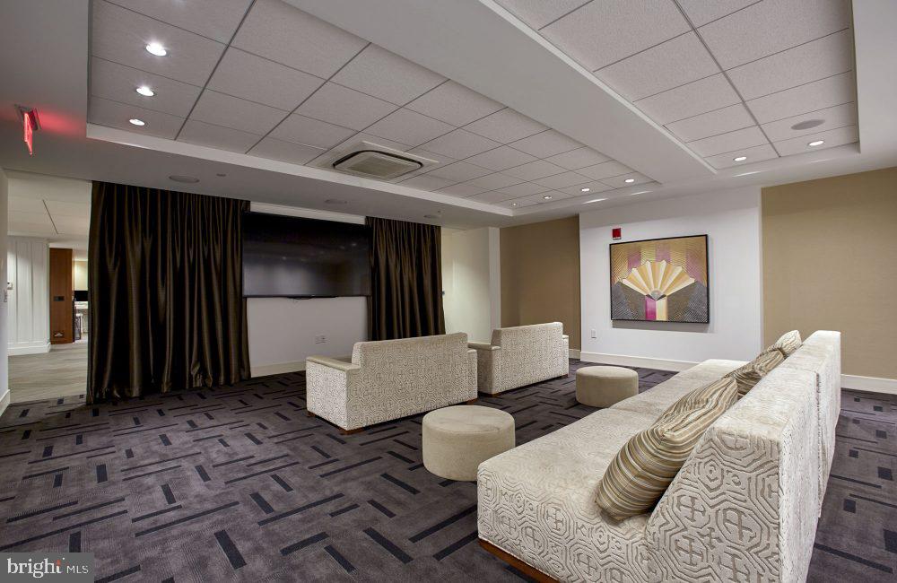 1616 Walnut Street, Unit 1B1102 Philadelphia, PA 19103 - Photo 20 of 28 a living room with furniture and a walk in closet