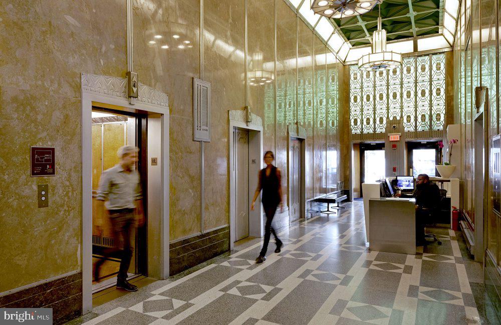 1616 Walnut Street, Unit 1B1102 Philadelphia, PA 19103 - Photo 7 of 28 a lobby with furniture and a chandelier