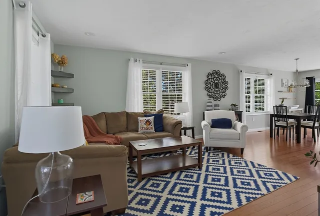 a living room with furniture and a table