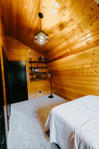 1413 Basel Drive Midway, UT 84049 - Photo 70 of 137 Bedroom with wood walls, a vaulted wooden ceiling, and carpet