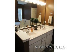 371 Planters Creek Road Fletcher, NC 28732 - Photo 18 of 24 a bathroom with a sink and a mirror