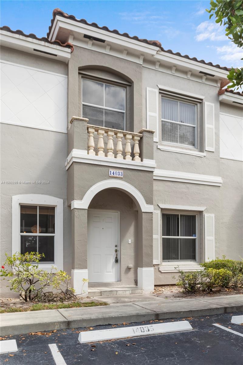 14033 Southwest 49th Street, Unit 6 Miramar, FL 33027 - Photo 1 of 25 a front view of a house