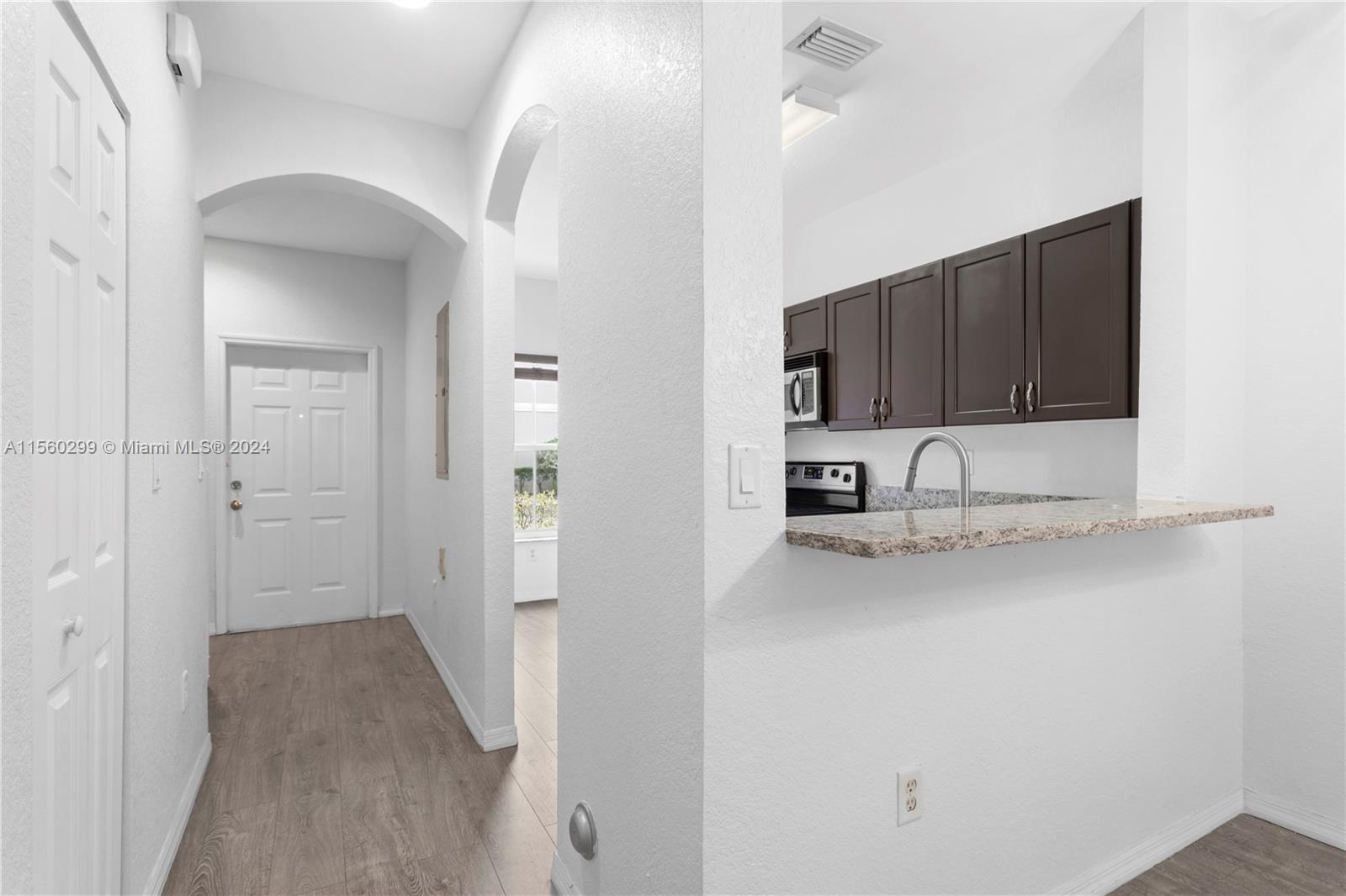 14033 Southwest 49th Street, Unit 6 Miramar, FL 33027 - Photo 13 of 25 a view of a kitchen with a sink and cabinets