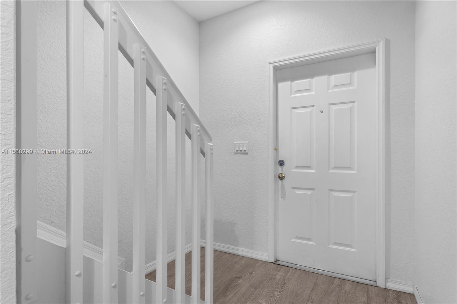 14033 Southwest 49th Street, Unit 6 Miramar, FL 33027 - Photo 14 of 25 a view of a hallway with wooden floor and entryway