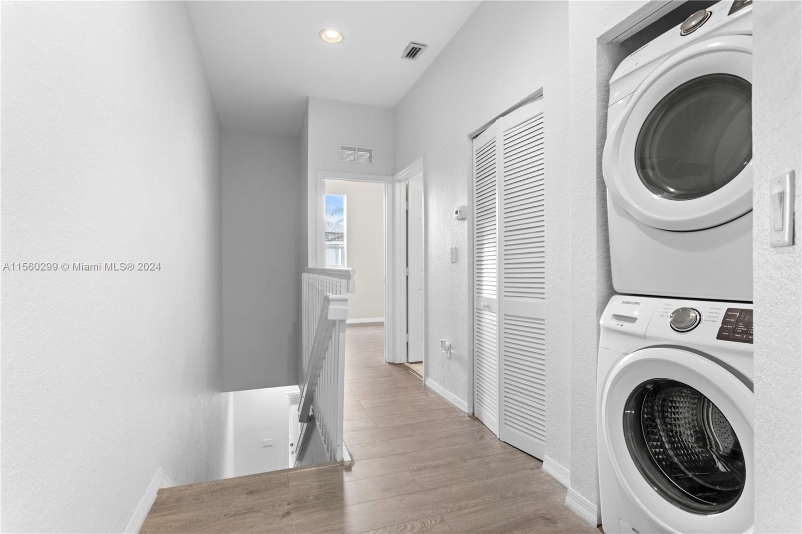 14033 Southwest 49th Street, Unit 6 Miramar, FL 33027 - Photo 20 of 25 a view of a hallway with washer and dryer