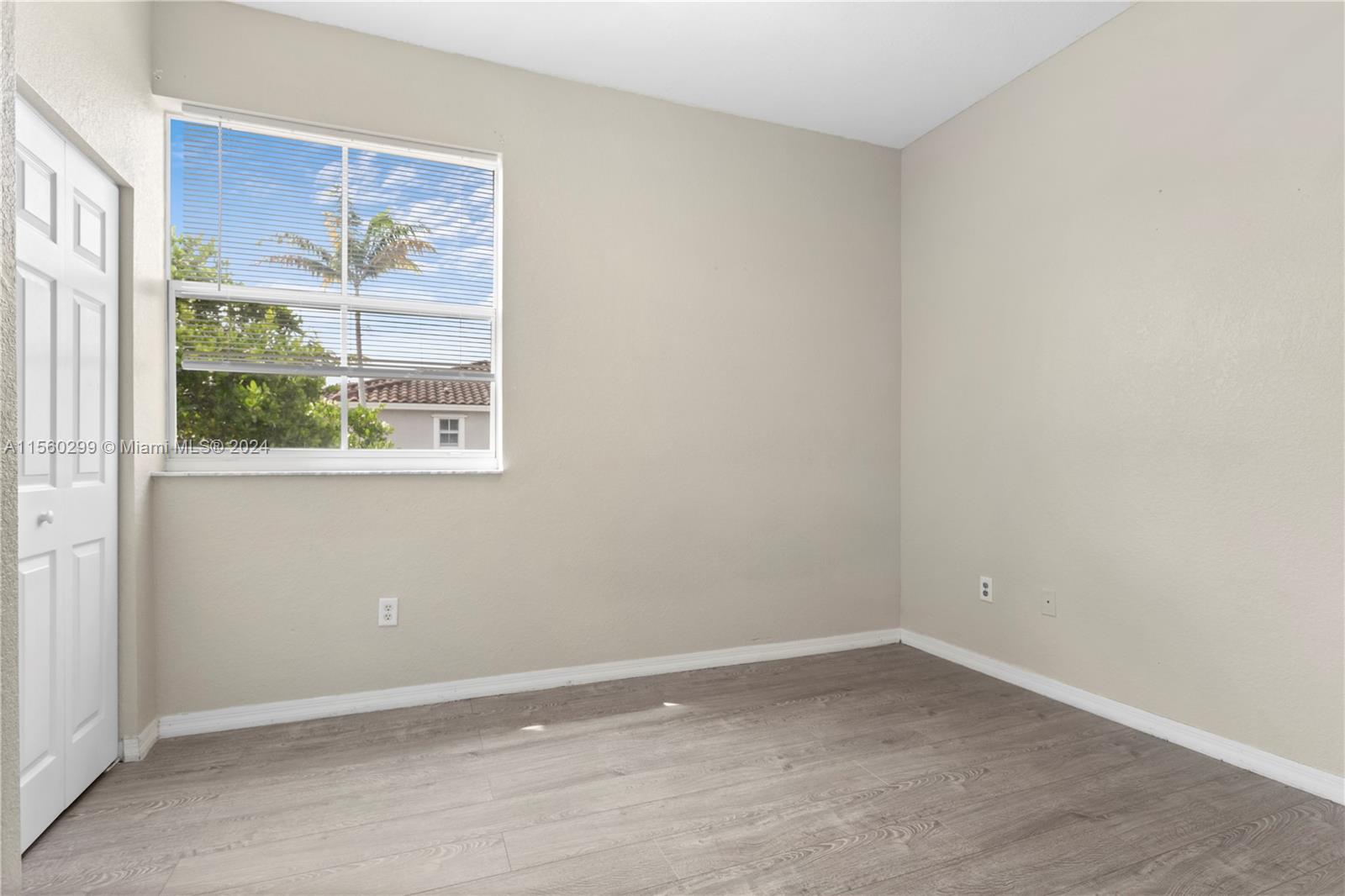 14033 Southwest 49th Street, Unit 6 Miramar, FL 33027 - Photo 21 of 25 an empty room with a window