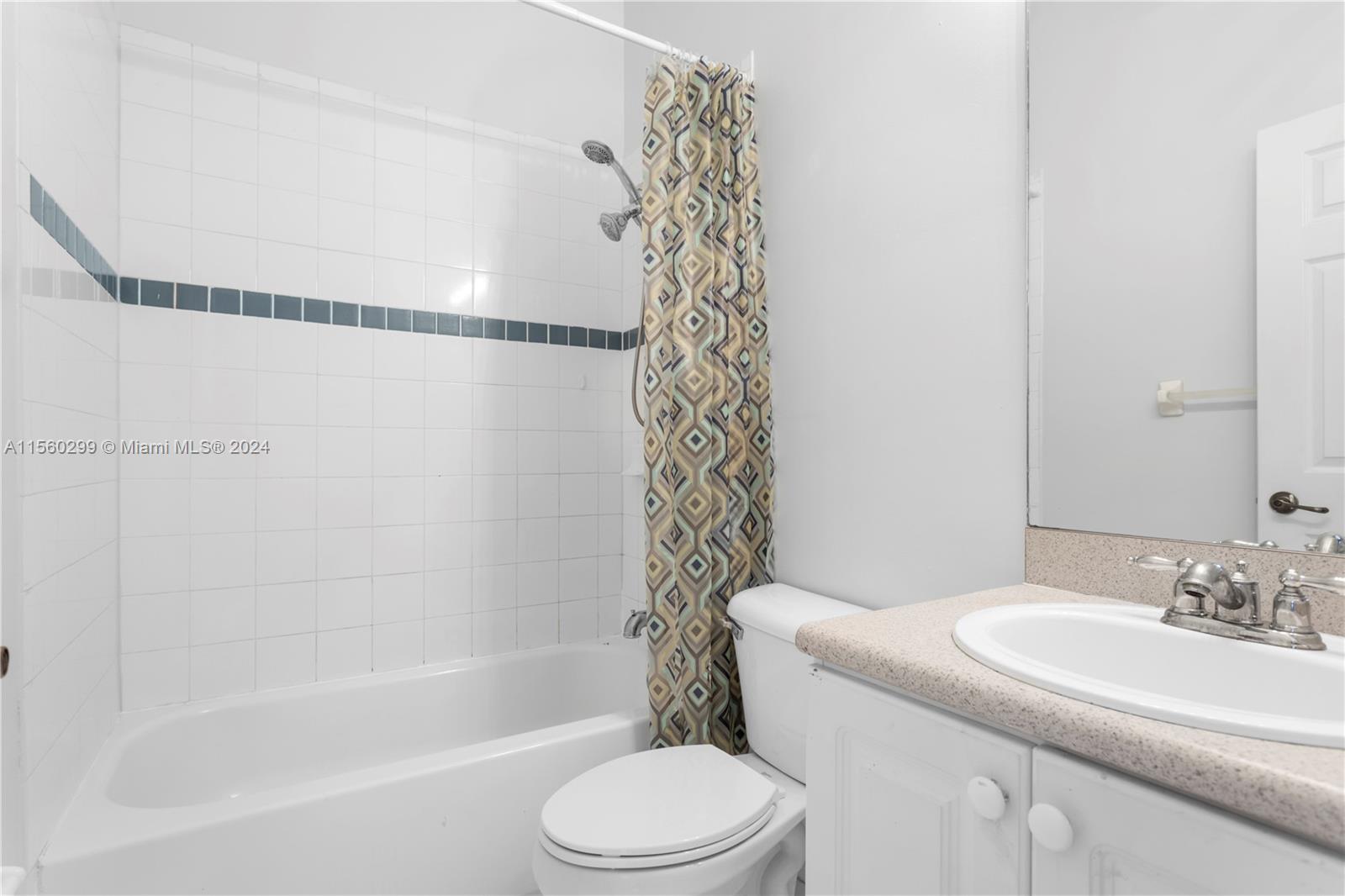 14033 Southwest 49th Street, Unit 6 Miramar, FL 33027 - Photo 23 of 25 a bathroom with a bathtub a sink and a toilet
