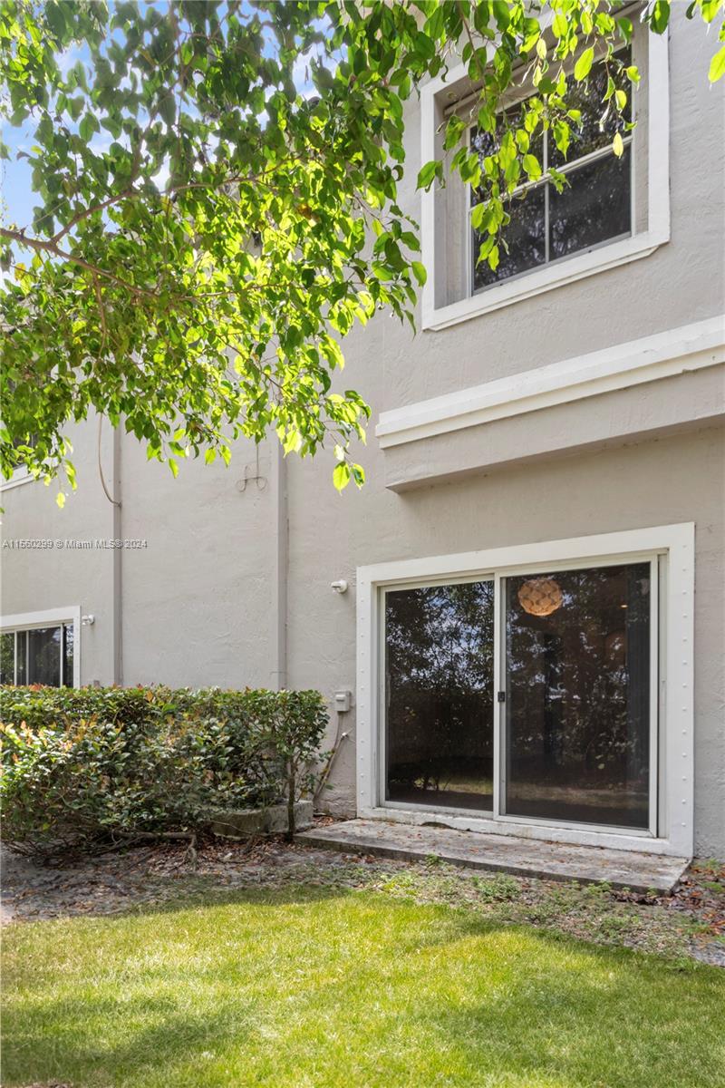 14033 Southwest 49th Street, Unit 6 Miramar, FL 33027 - Photo 24 of 25 front view of a house with a yard