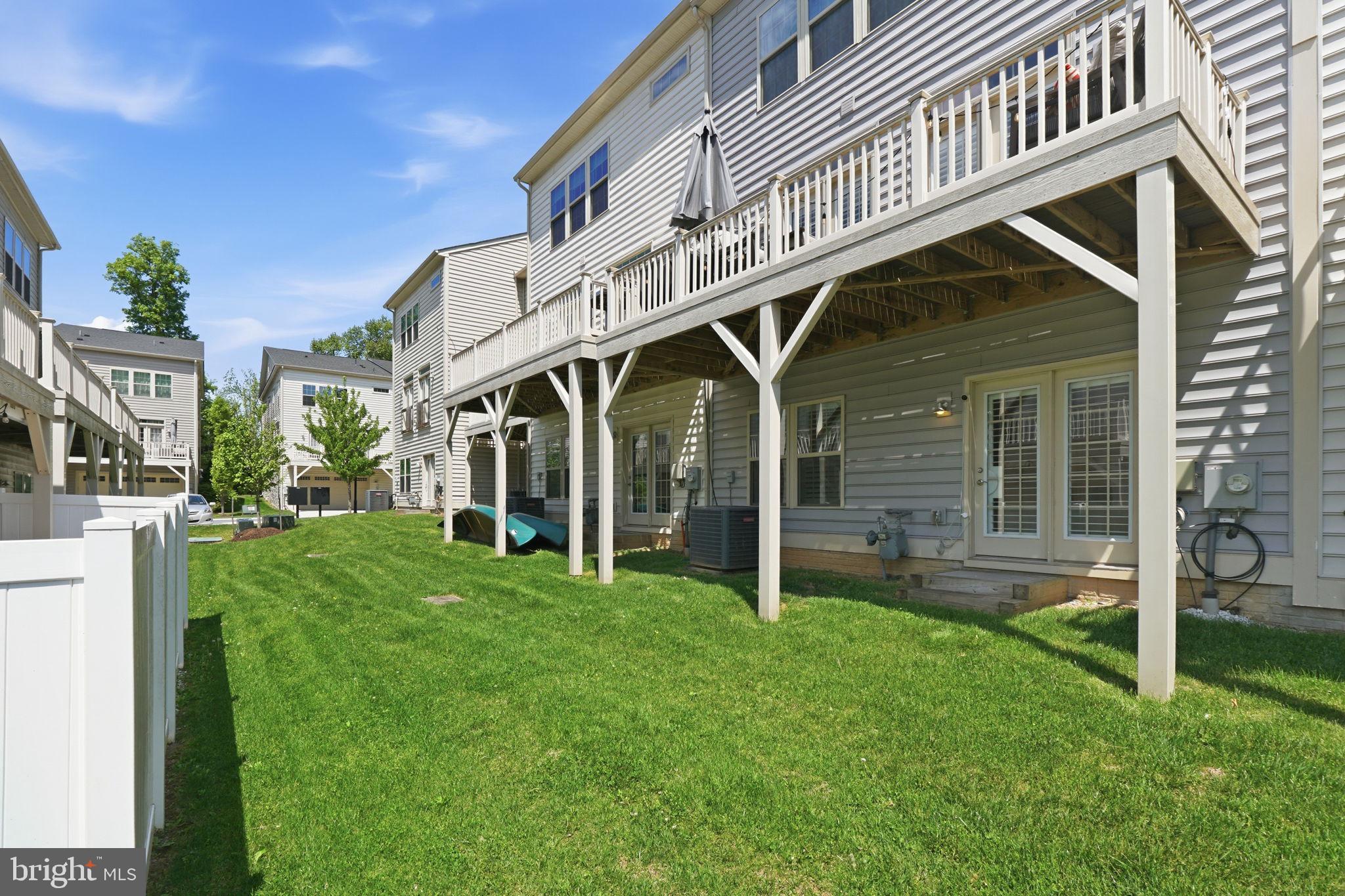 17812 Thomas Village Lane Sandy Spring, MD 20860 - Photo 35 of 37 a view of a house with backyard and porch