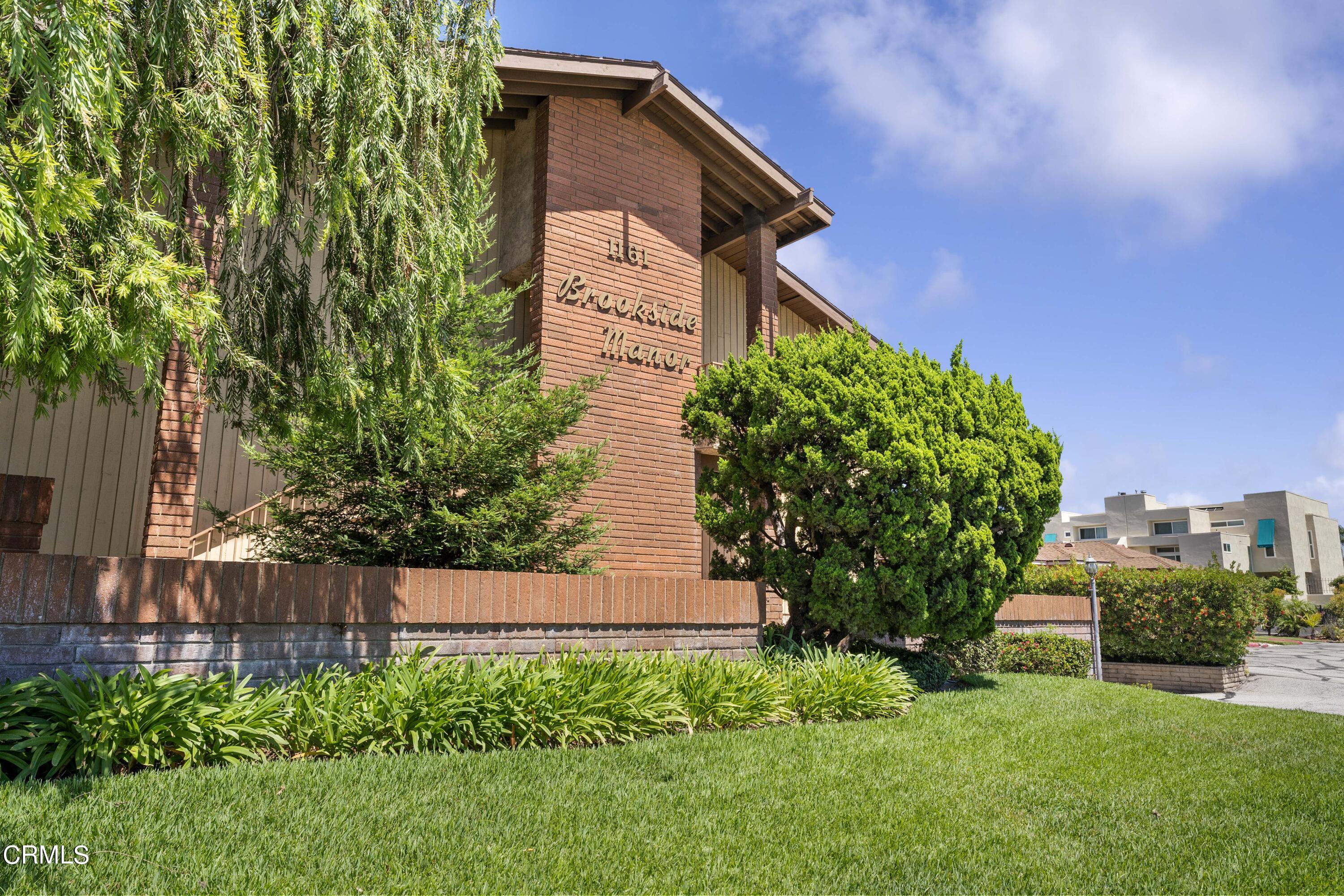 1161 West Duarte Road, Unit 20 Arcadia, CA 91007 - Photo 1 of 6 a backyard of a house with lots of green space
