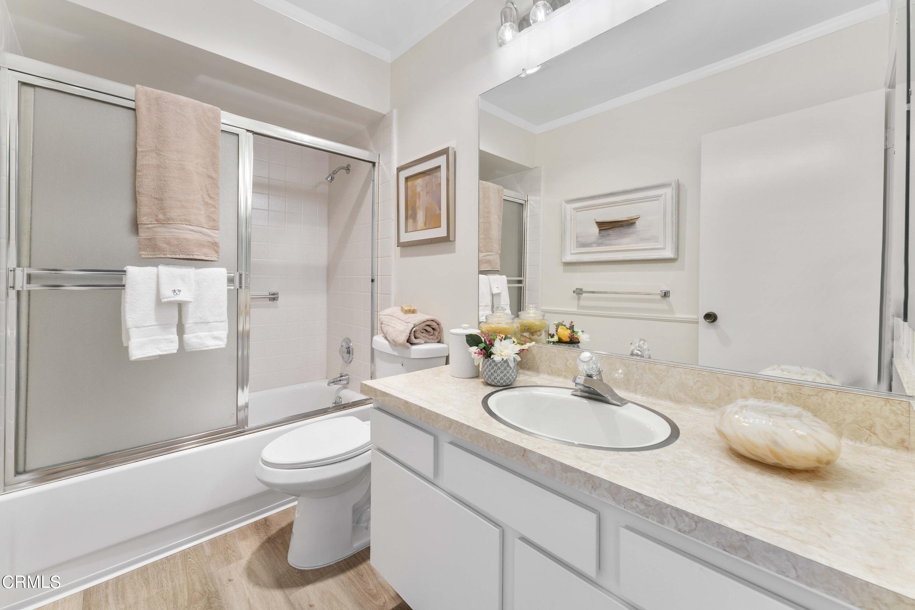 1161 West Duarte Road, Unit 20 Arcadia, CA 91007 - Photo 6 of 6 a bathroom with a granite countertop sink toilet and shower