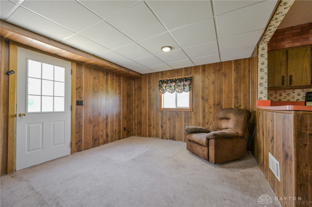 3057 Springfield Xenia Road Springfield, OH 45506 - Photo 29 of 37 This versatile room features warm wood paneling, soft carpeting, and a convenient exterior door.