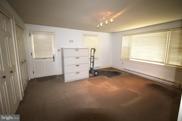 an empty room with windows