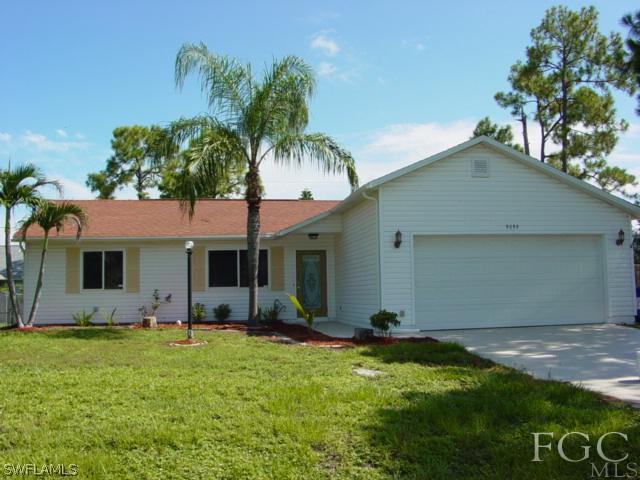 9099 Bryant Road Fort Myers, FL 33967 - Photo 1 of 8 a front view of house with yard