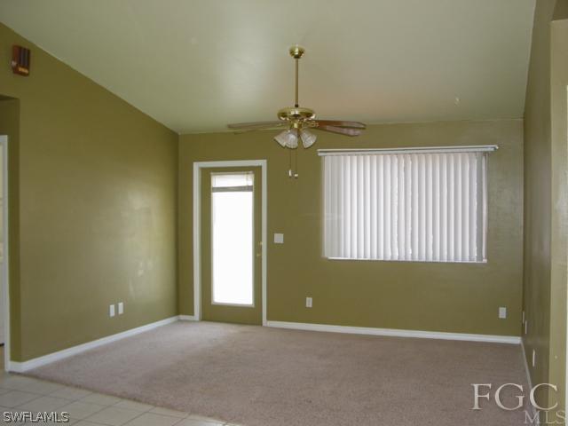 9099 Bryant Road Fort Myers, FL 33967 - Photo 3 of 8 a view of an empty room with a window